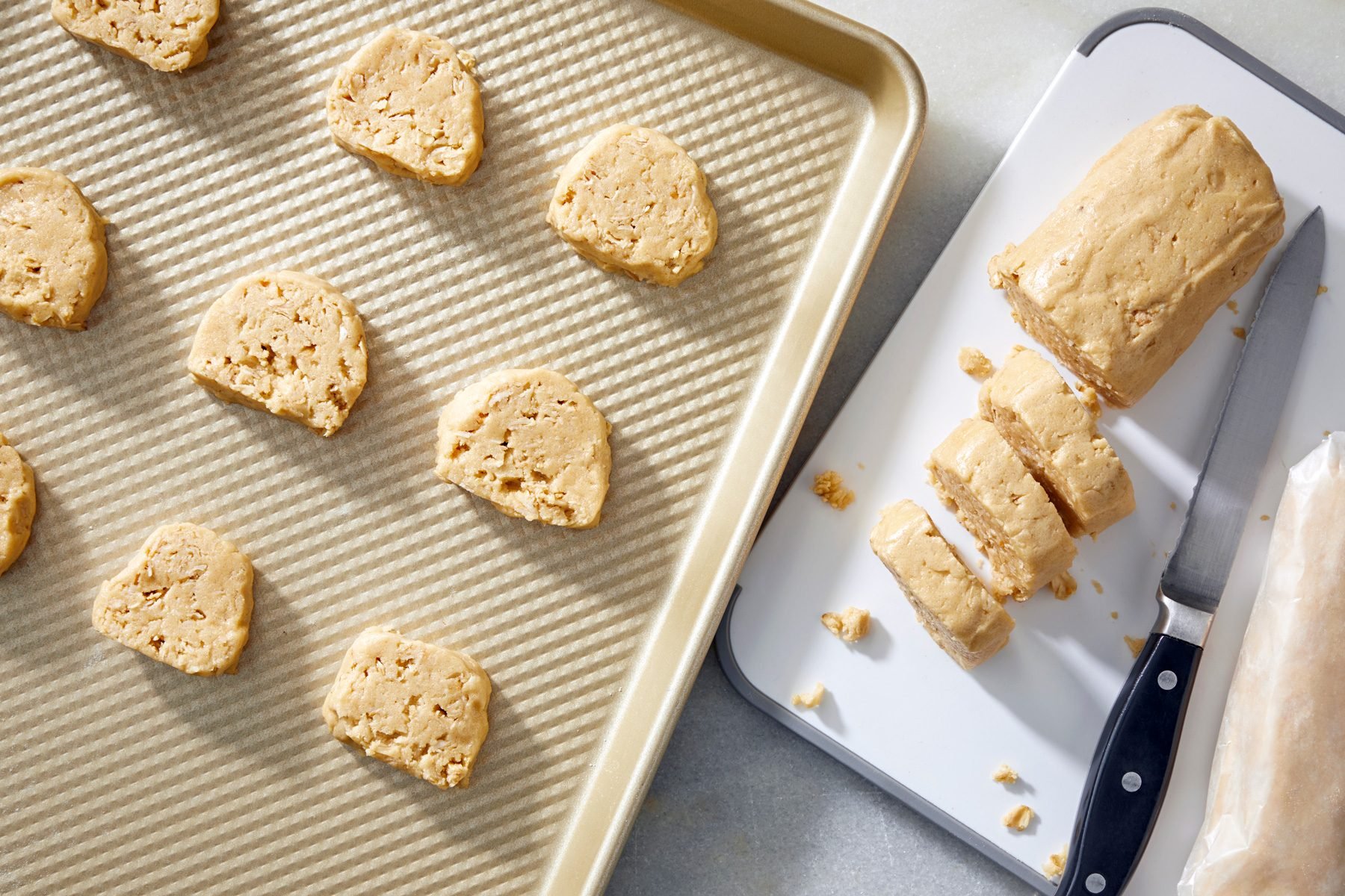 top view shot of cookie dough cut in small portions on baking tray
