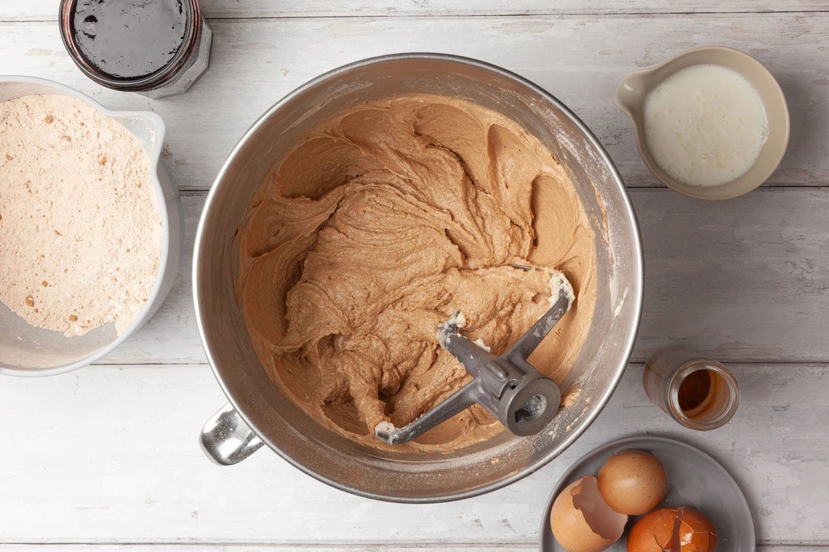 Step 2 of Taste of Home Jam Cake is to cream the butter and sugar together in a large mixing bowl for 5 to 7 minutes, or until they’re light and fluffy. Add the eggs one at a time, beating the mixture well after each addition. Combine the dry ingredients and whisk them until they’re well mixed. Gradually add the dry ingredients to the bowl, alternating them with the jam and the buttermilk. Beat the batter well after each addition. Stir in the raisin mixture and the nuts.