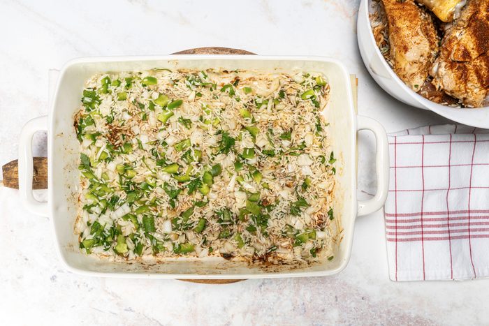 Covering the bottom of the pan with the rice mix