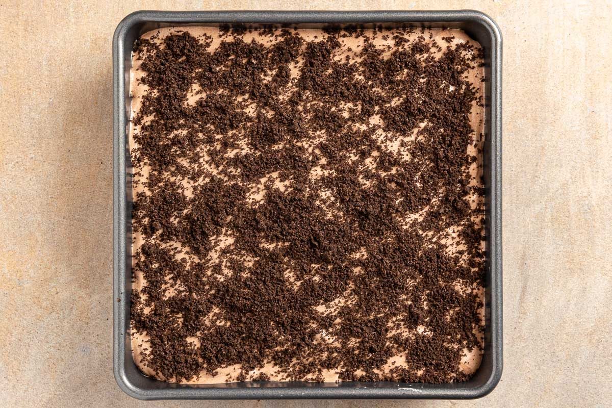 Taste of Home Peanut Butter Lasagna recipe photo of the crushed cookie topping added to the baking dish.