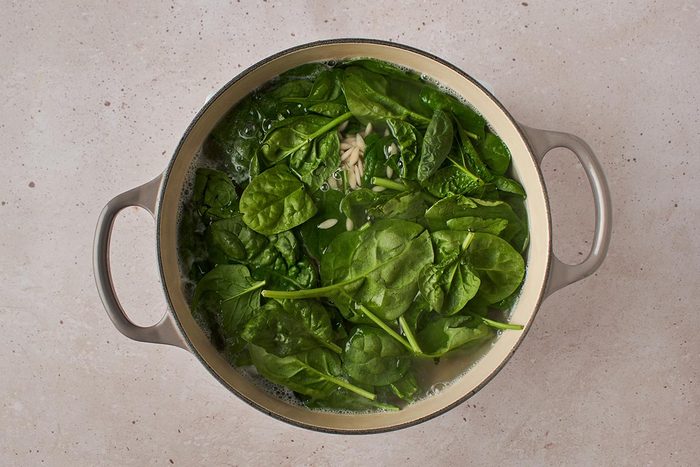 Cook orzo and add spinach