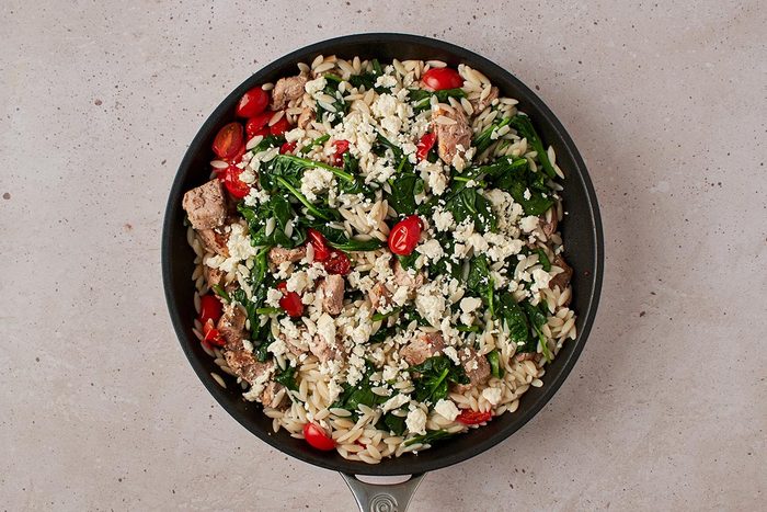 Add orzo mixture and feta