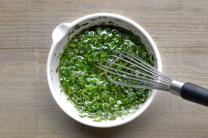 Olive oil, lemon zest, lemon juice, garlic, parsley, mint and salt whisked in a small bowl.
