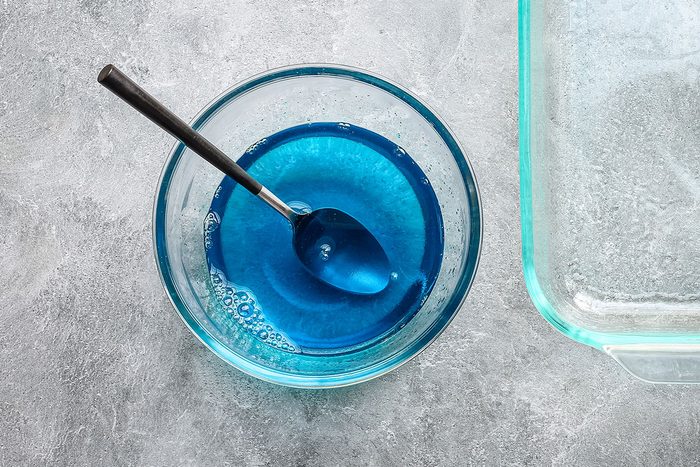 Rainbow jello cubes preparation, combining the jello and water.