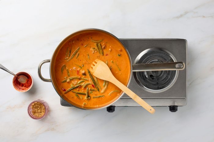 Simmer vegetables in curry