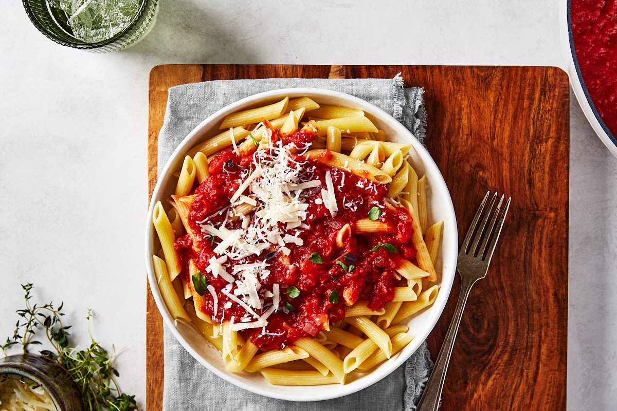Red Wine Pasta Hero- Bowl of pasta topped with sauce and cheese