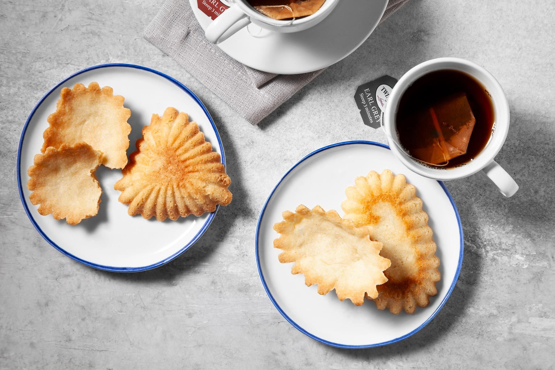 wide shot of sandbakkelse served with tea