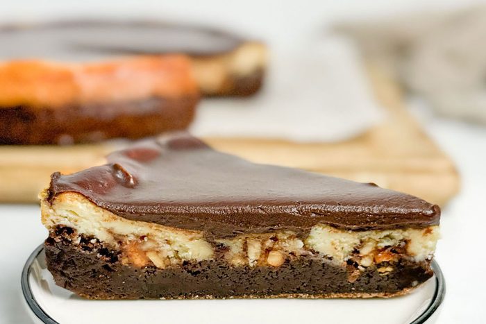 Taste of Home Snickers Cheesecake on a white plate