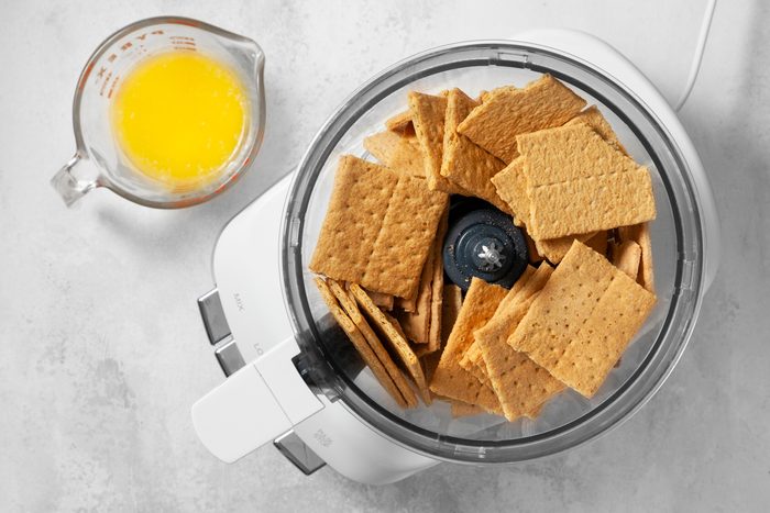 overhead shot graham crackers placed in a food processor