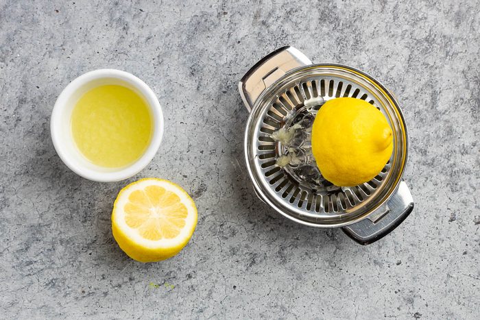 Taste of Home Strawberry Sorbet recipe photo of lemon squeezed and bowl of fresh lemon juice.