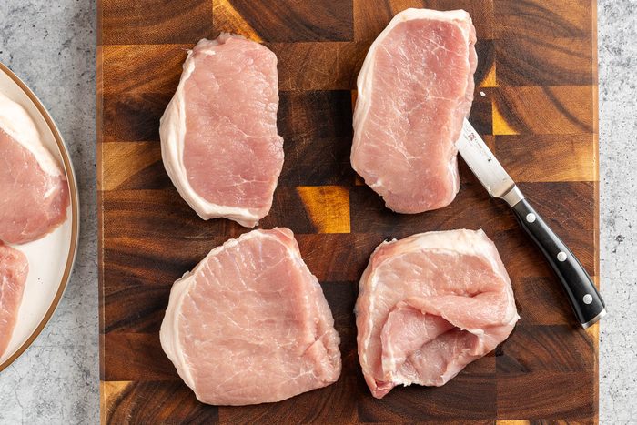 Taste of Home Stuffed Pork Chops photo of cutting the chops for stuffing.