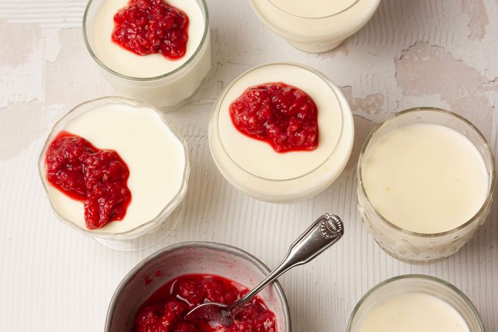 Step 3 of Taste of Home Swedish Creme is to lightly crush the raspberries and gently stir in the remaining sugar. Spoon over the tops of the creams.