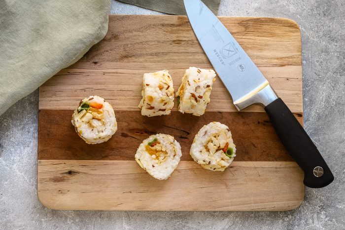 Slicing the chicken tempura roll.