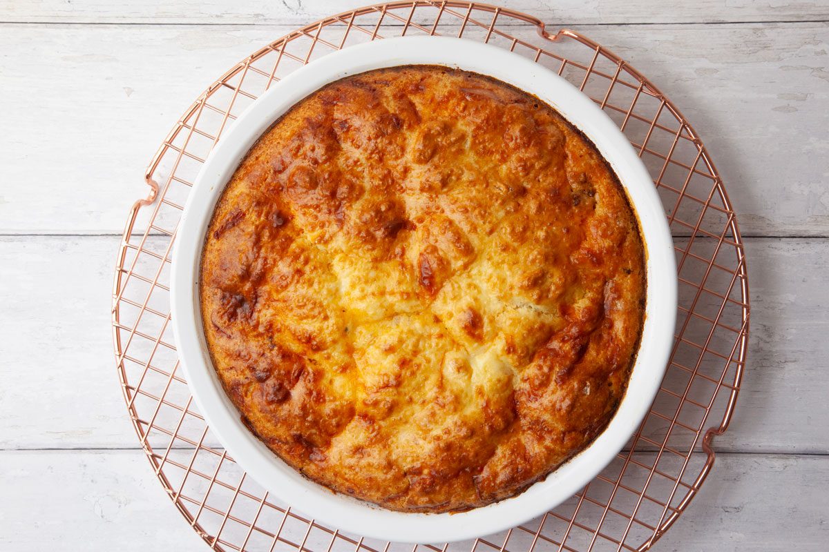 Step 5 of Taste of Home Taco Pie is to Bake in the preheated oven for 25 to 30 minutes, or until a knife inserted into the center of the pie comes out clean. The top should be golden brown and slightly puffed.