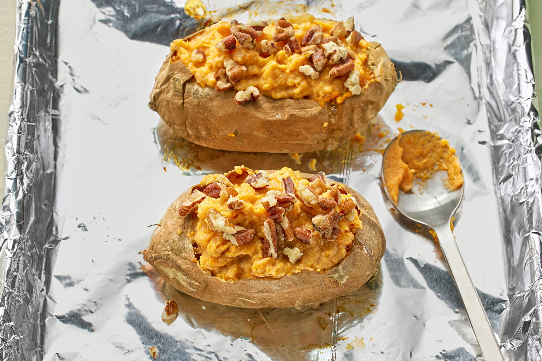 Potato pulp, cream cheese, brown sugar and cinnamon mixture spooned inside potato shells.