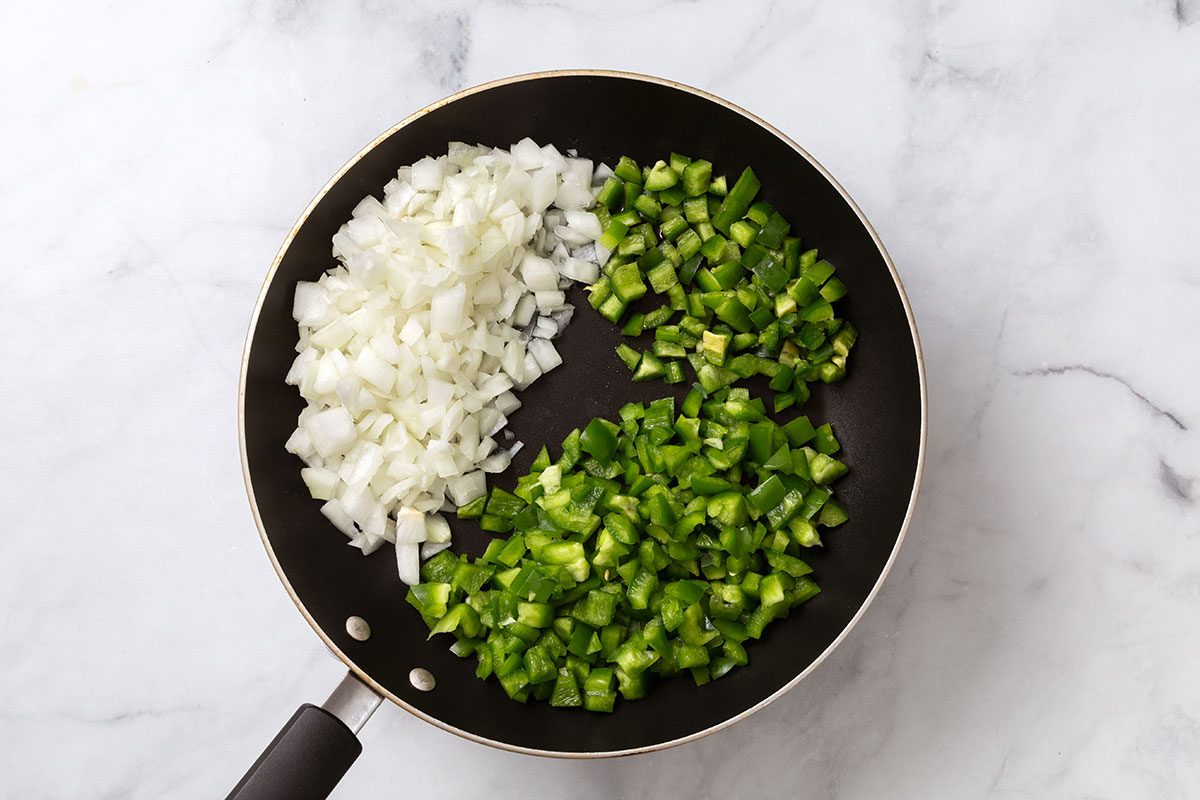 Sauté onion, green pepper and jalapeño in a large skillet
