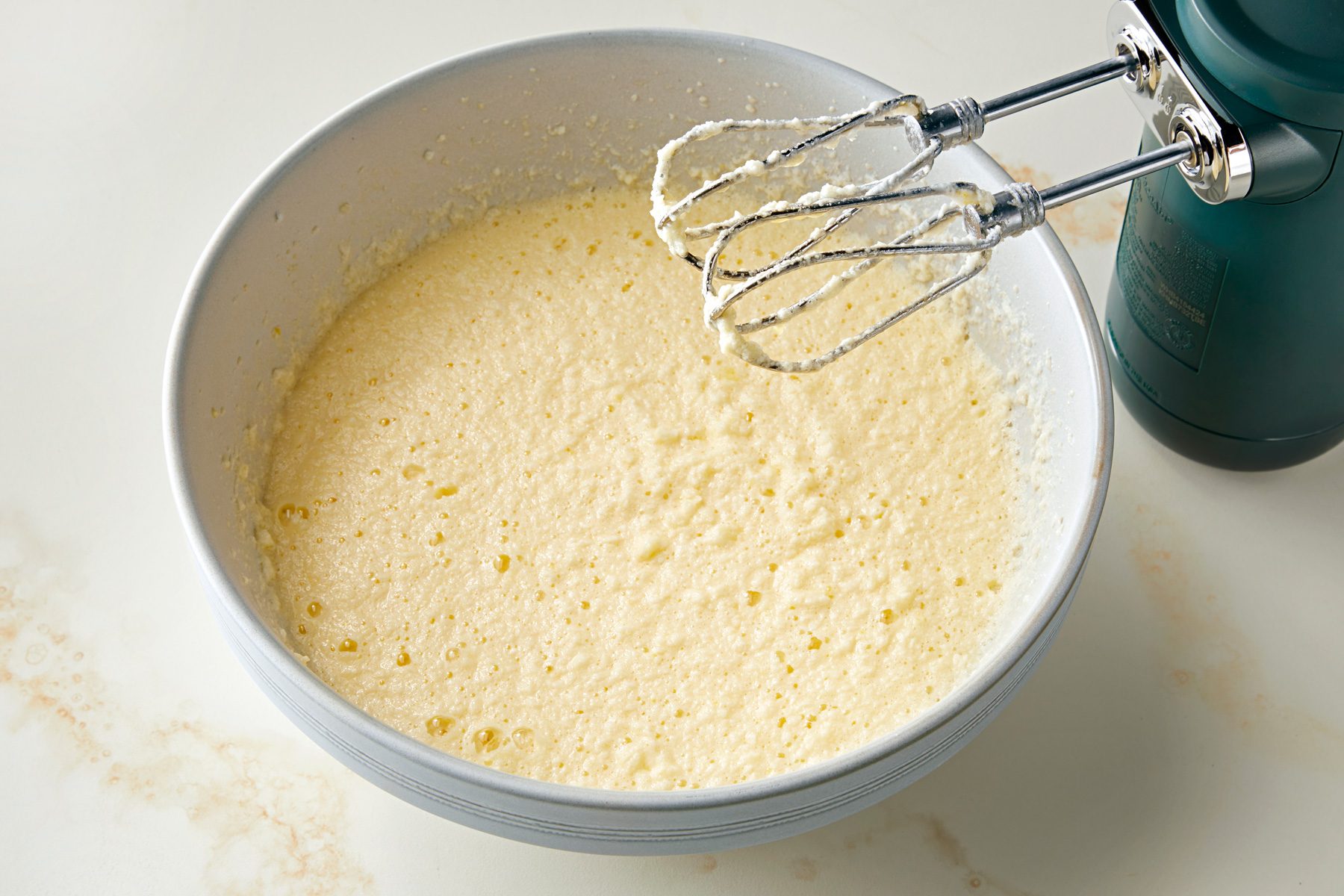 Cream butter sugar eggs blended in a bowl