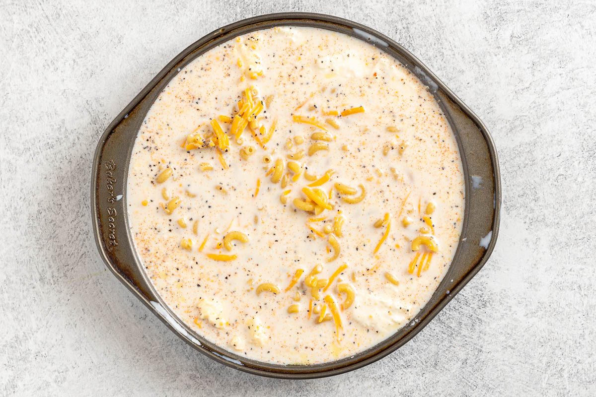 Taste of Home Air Fryer Mac and Cheese photo of adding all the ingredients to an 8 inch baking pan.