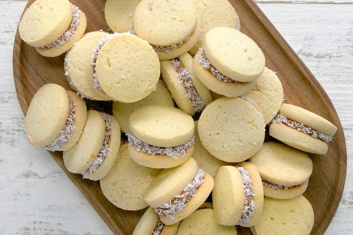 Alfajores cookies on a wooden tray