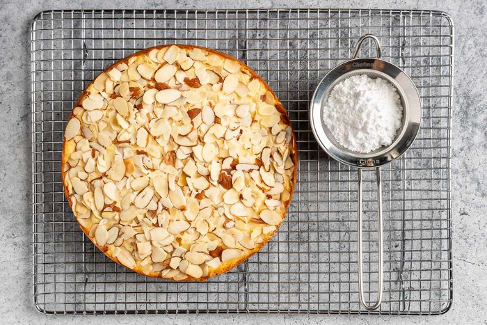 Taste of Home Almond Ricotta Cake photo of the baked caked with confectioners sugar for dusting.