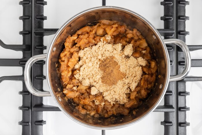 Apple mixture filling being prepared on stockpot.
