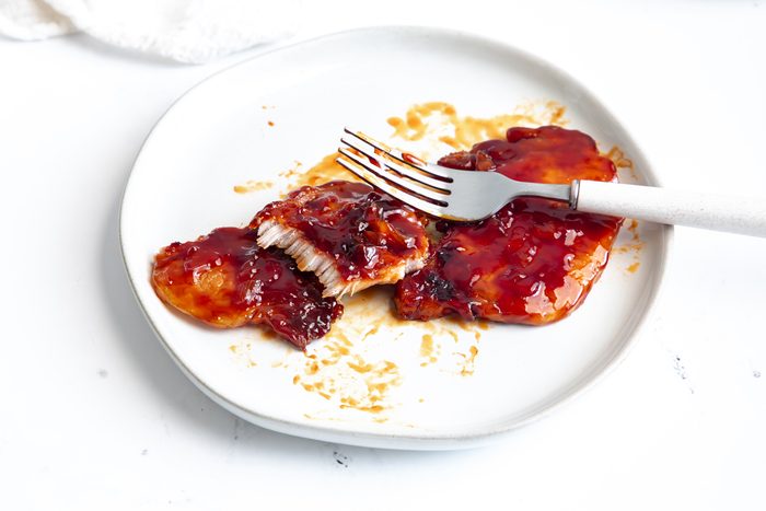 Close up beauty shot for Taste of Home BBQ Pork Chops being served on a plate.