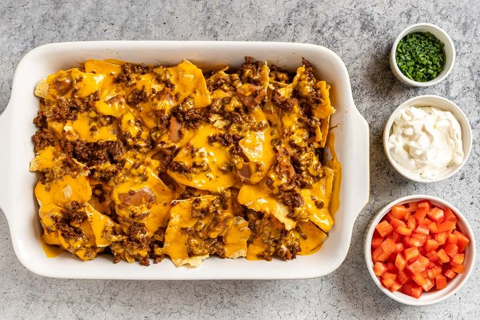 Taste of Home Baked Nachos photo of layering and baking the nachos.