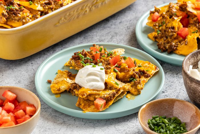 Taste of Home Baked Nachos photo of the finished recipe served on plates.