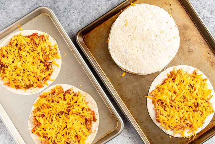 filling tortillas for Bbq Chicken Quesadillas