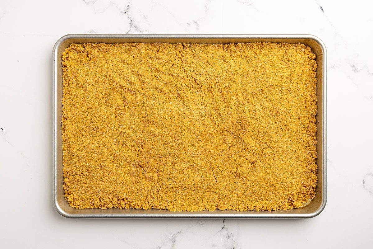 graham cracker crumbs in a sheet pan.