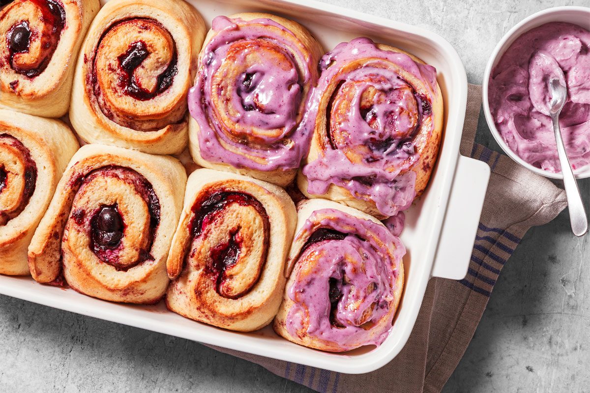 Spread Frosting On Warm Cinnamon Rolls.