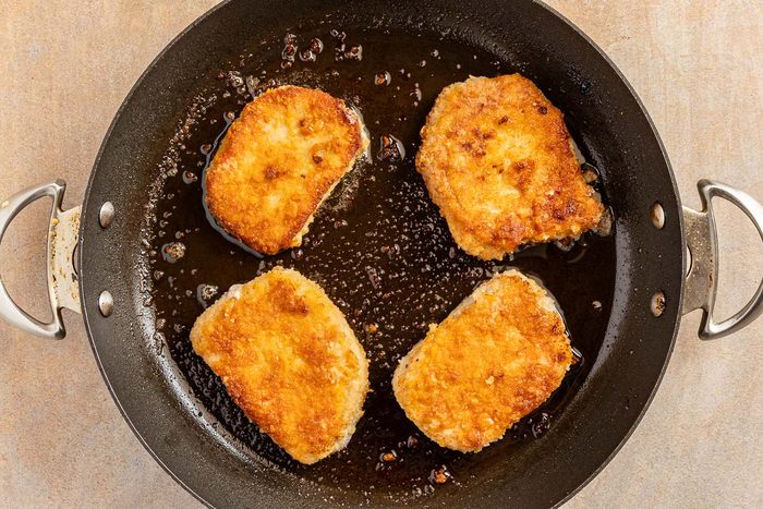cooking the breaded pork chops