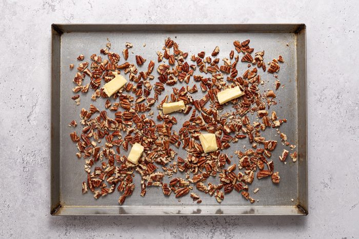 Chopped Pecans And Butter In Baking Pan