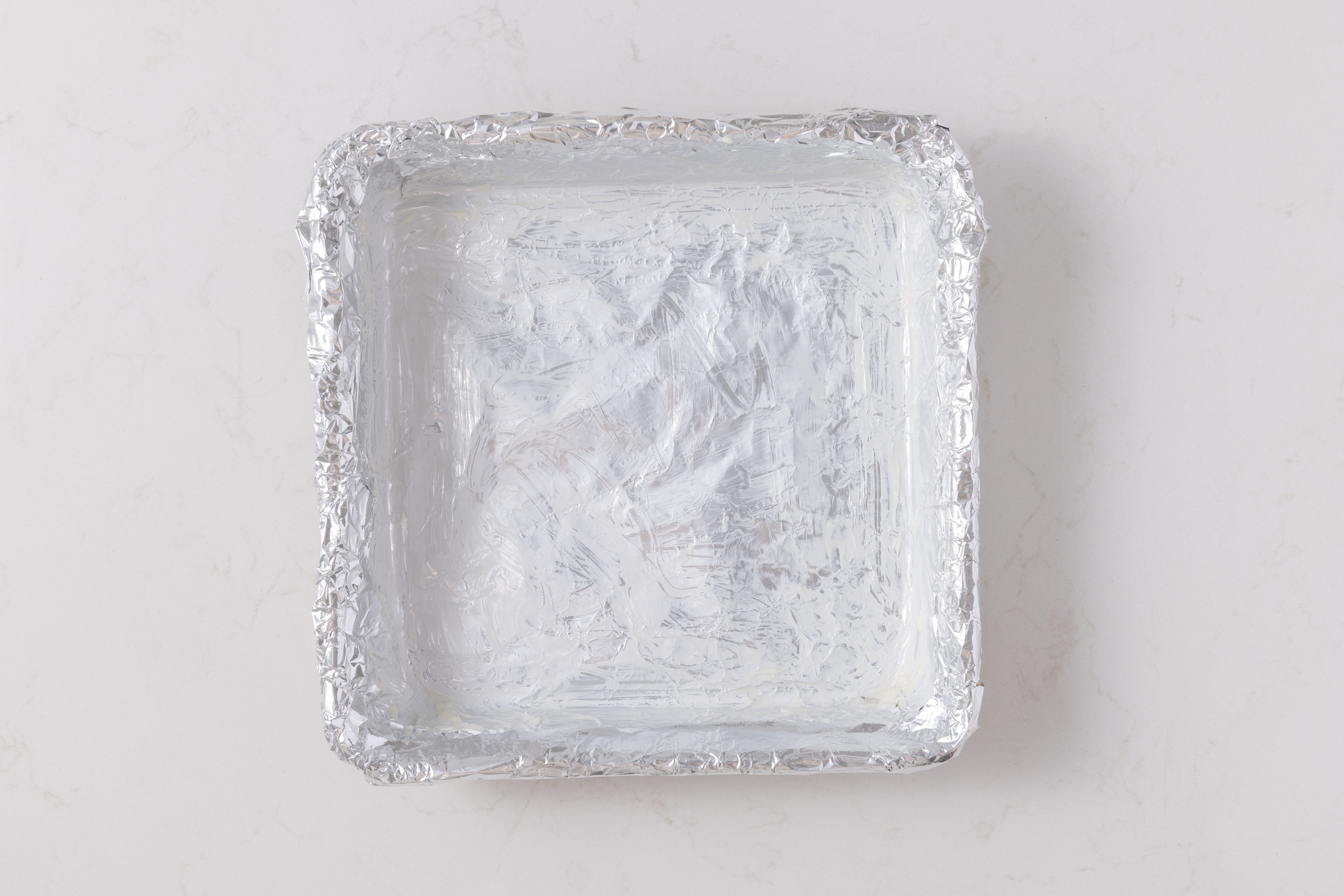 Square pan lined with greased foil.
