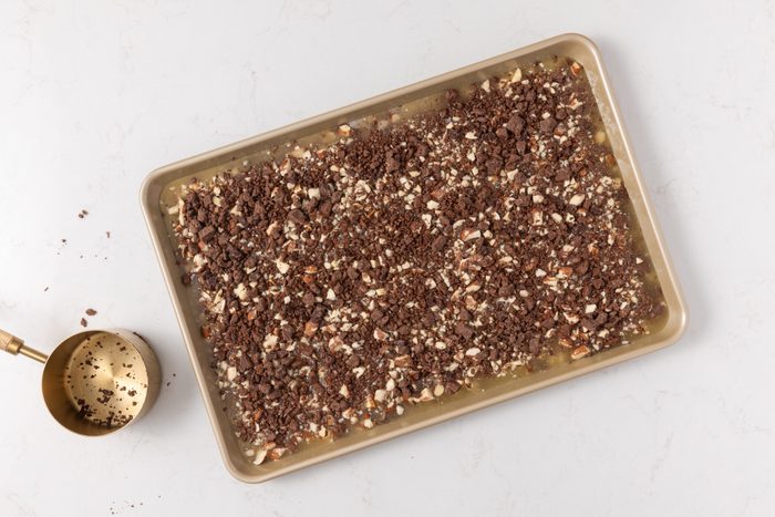 Butter toffee being assembled on tray.