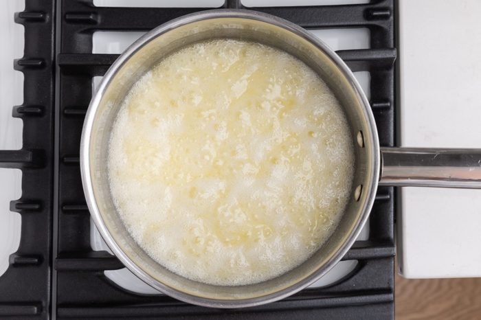 Butter, water and sugar being brought to a boil to form the toffee base.