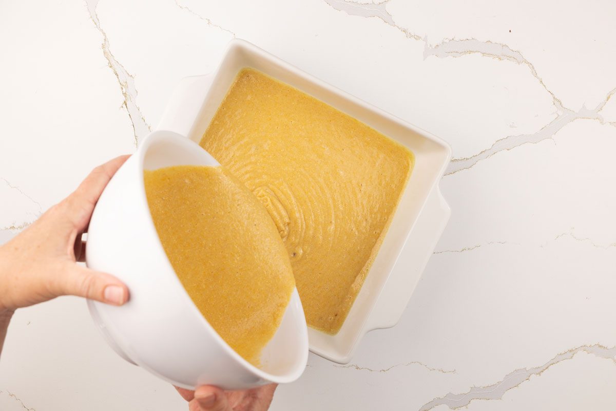 pouring Buttermilk Cornbread batter into pan