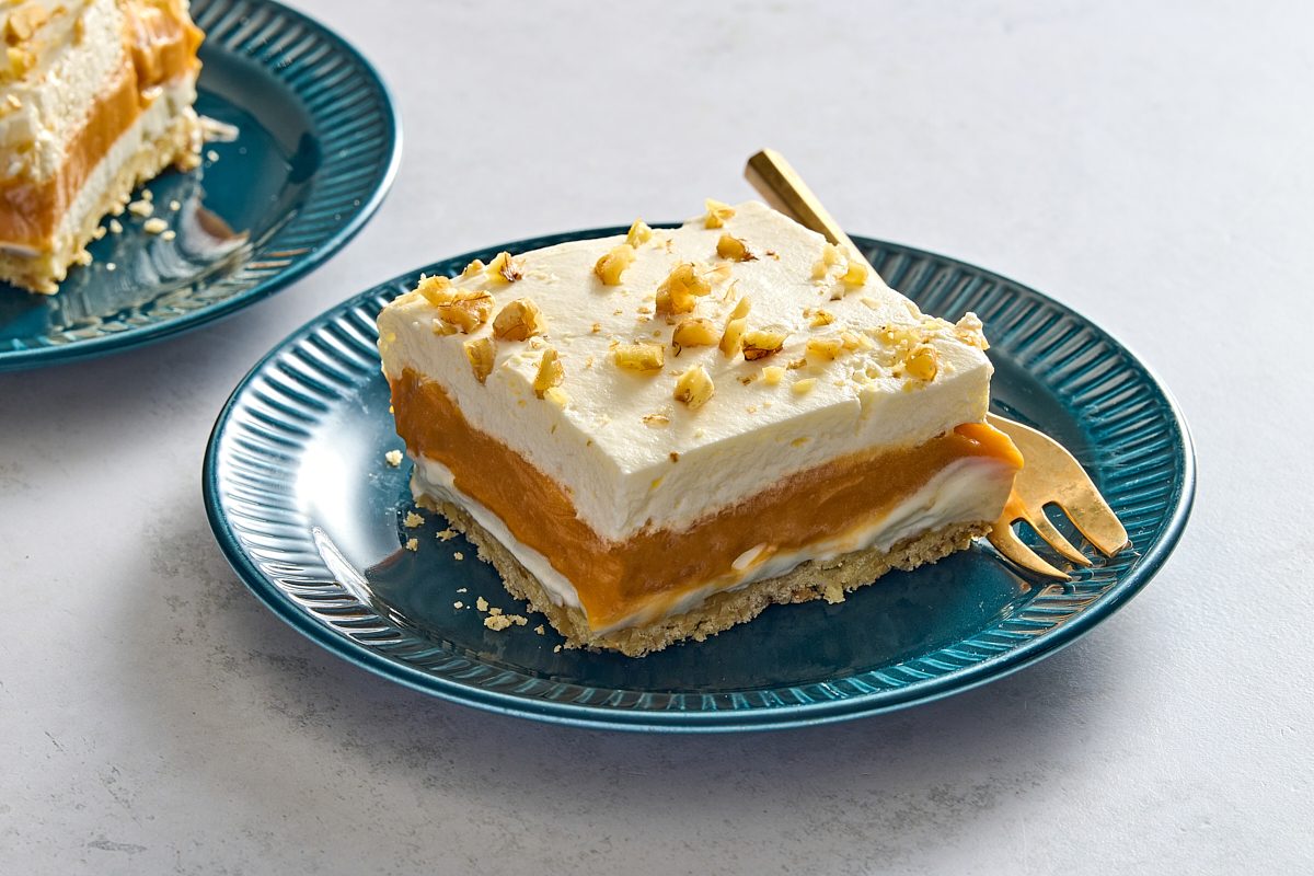 Angled shot of two plates with slices of butterscotch delight