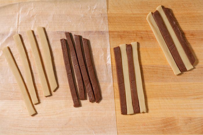 Stack the strips in groups of 4, alternating plain and chocolate strips and forming 8 separate stacks.