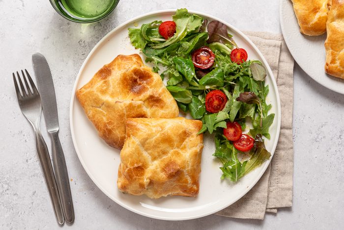 Plate With Pockets Of Chicken In Puff Pastry And Salad
