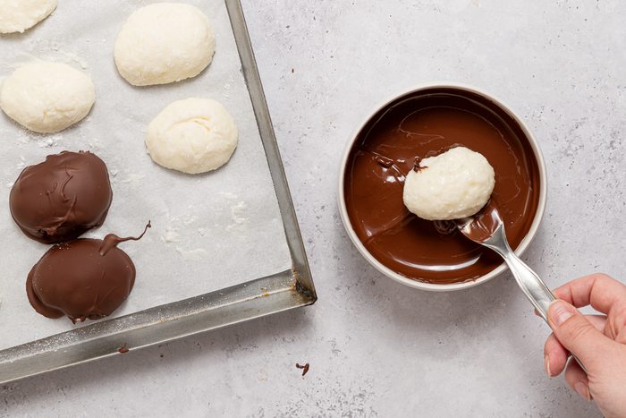 Frozen Cream Cheese Coconut Eggs Dipped In Melted Chocolate
