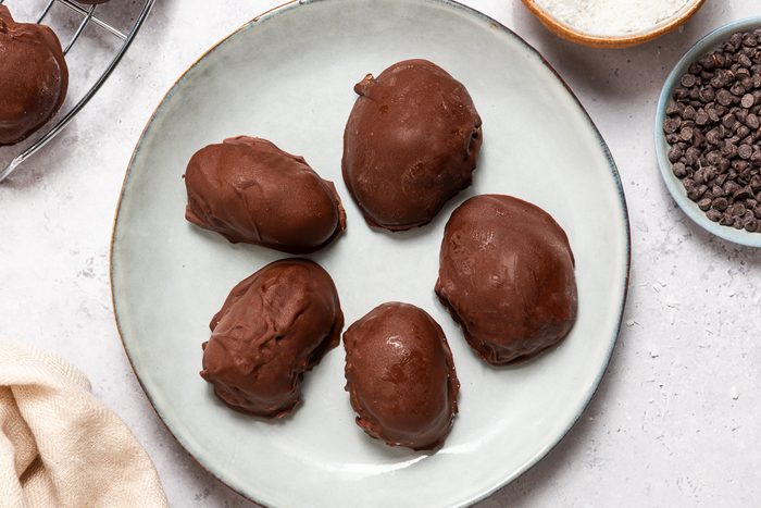 Frozen Cream Cheese Coconut Eggs Dipped In Melted Chocolate