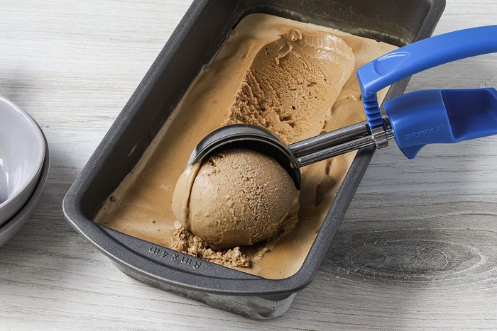 Scooping homemade coffee ice cream, a recipe from Taste of Home.