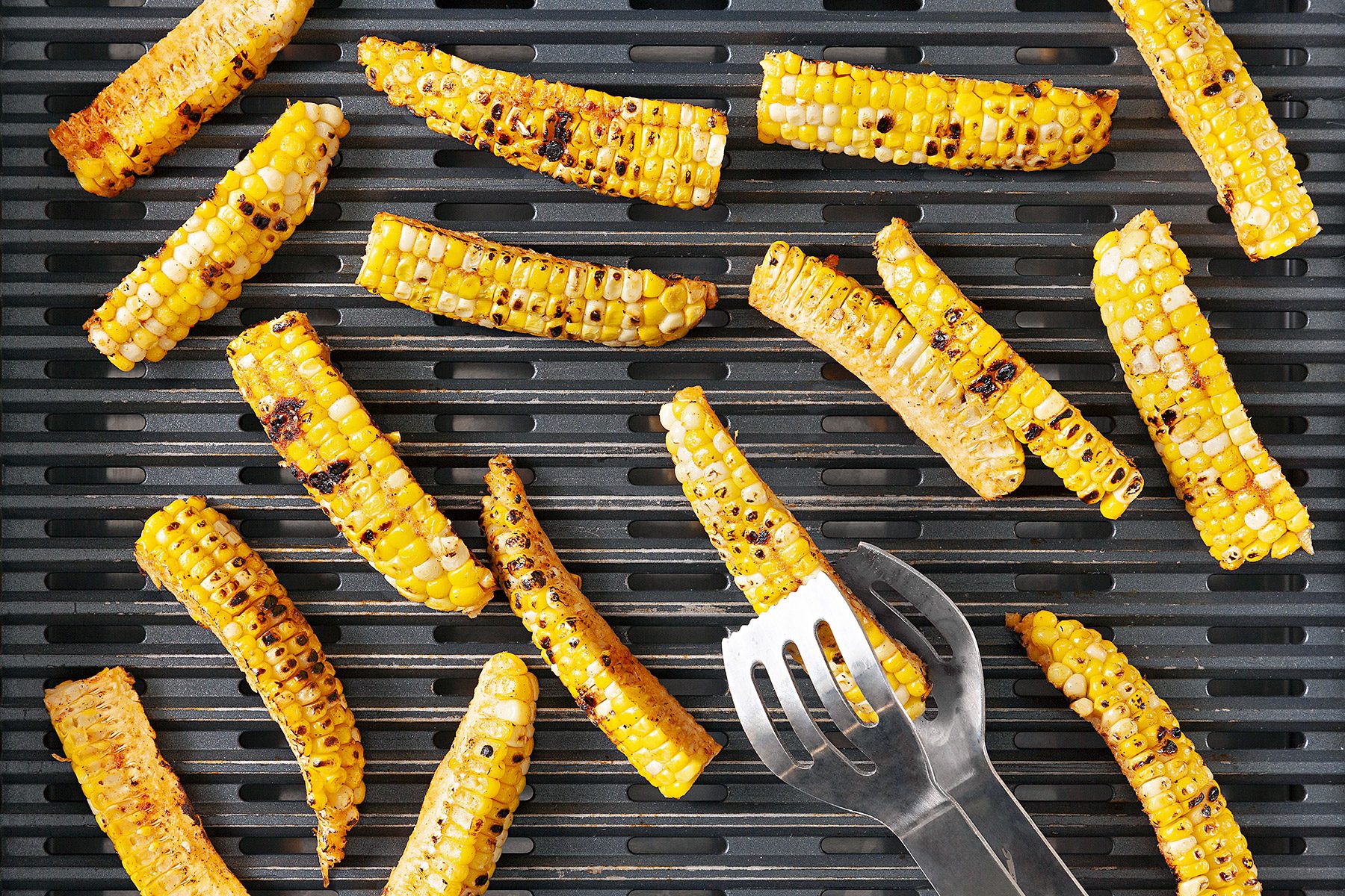 Overhead shot of grill each corn rib kernel-side down; until corn begins to char; tongs;