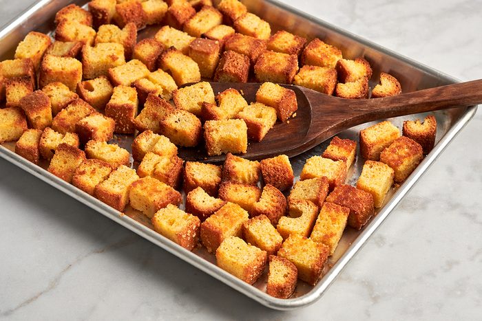 Crunchy, savory cornbread croutons recipe by Taste of Home