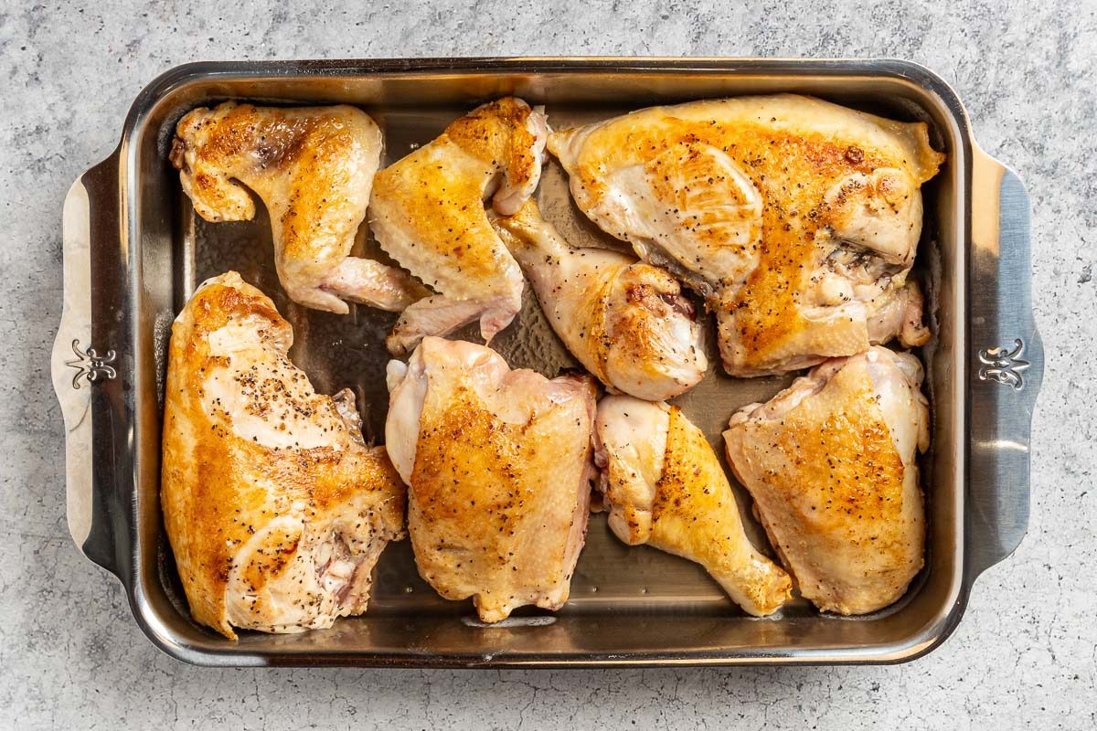 Taste of Home Cranberry Chicken Recipe photo of the browned chicken in a greased 9 x 13 baking dish.