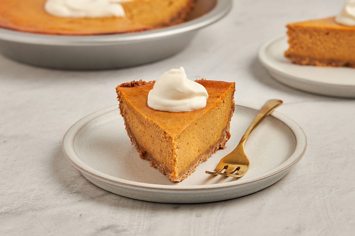 A buttery pecan shortbread crust and velvety spiced filling come together in this cream cheese pumpkin pie recipe by Taste of Home.