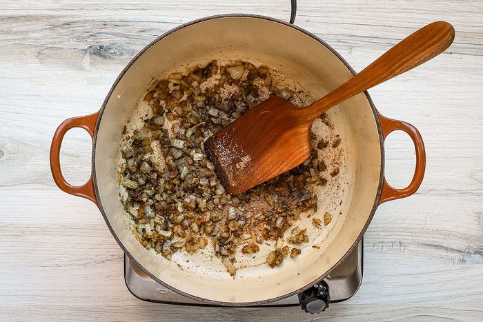 Sautéing vegetables for carrot soup.