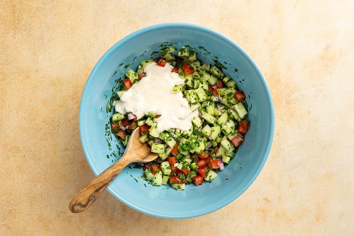 creamy dressing poured over the cucumber mixture.