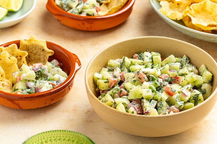 smaller side dishes filled with the salsa and chips.